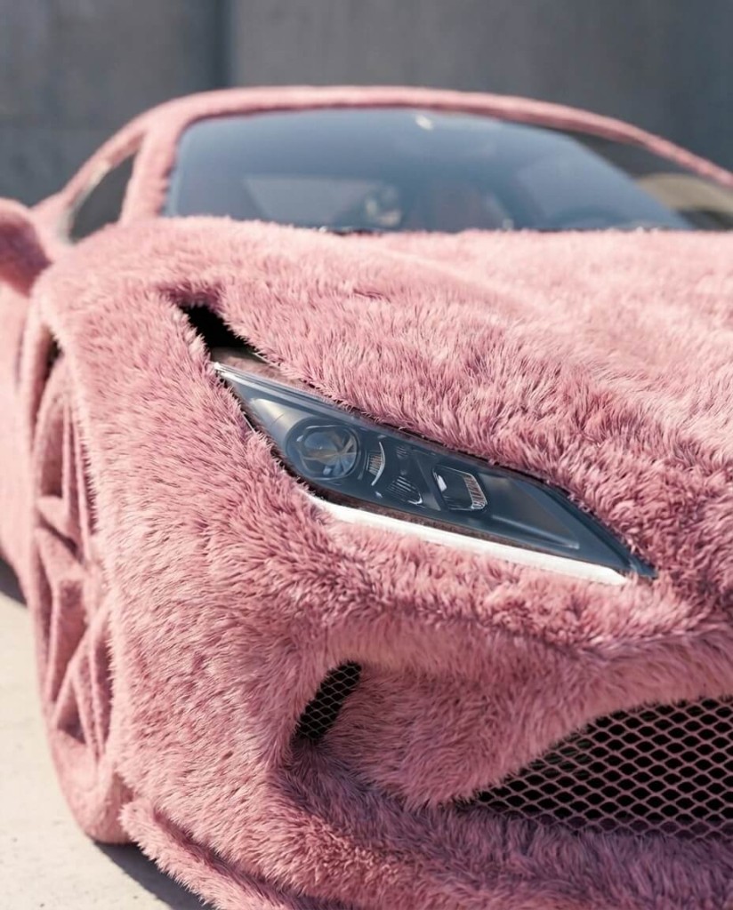 Stylized automotive texture study Luxury sports car wrapped in dusty pink faux fur, tight front three-quarter crop